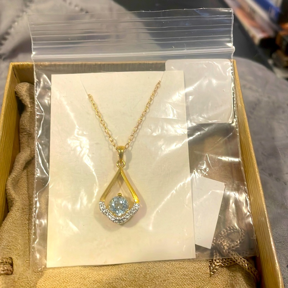 Sky blue topaz and diamond pendant necklace